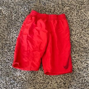 Red Nike swim trunks
